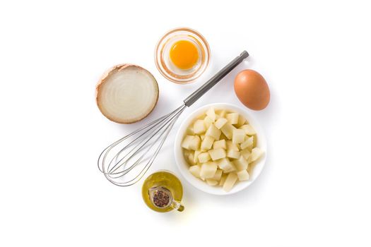 Spanish omelette tortilla ingredients: eggs, potatoes and onion isolated on white background. Top view