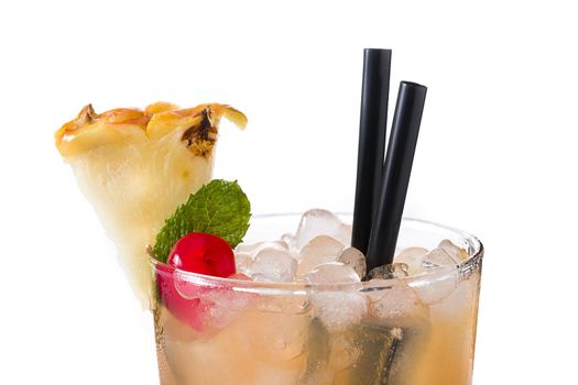 Cold mai tai cocktail with pineapple and cherry isolated on white background