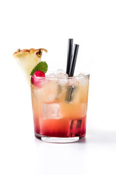 Cold mai tai cocktail with pineapple and cherry isolated on white background