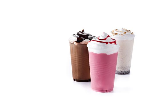 Strawberry, chocolate and white milkshakes isolated on white background