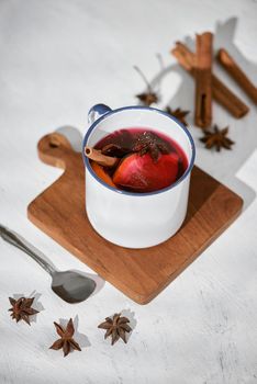 Cooking oranges in red wine with spices