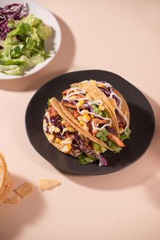 Traditional mexican taco with meat and vegetables. Latin american food.