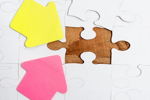 Building An Unfinished White Jigsaw Pattern Puzzle With Missing Last Piece