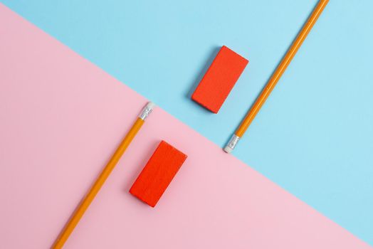Two Objects Arranged Facing Inward Outward On a Separated Coloured Background