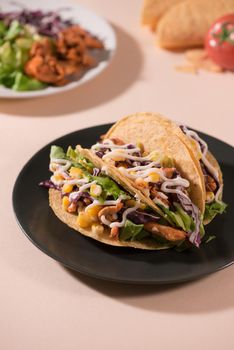 Traditional mexican taco with meat and vegetables. Latin american food.