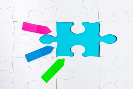 Building An Unfinished White Jigsaw Pattern Puzzle With Missing Last Piece
