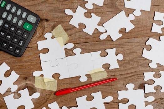 Building An Unfinished White Jigsaw Pattern Puzzle With Missing Last Piece