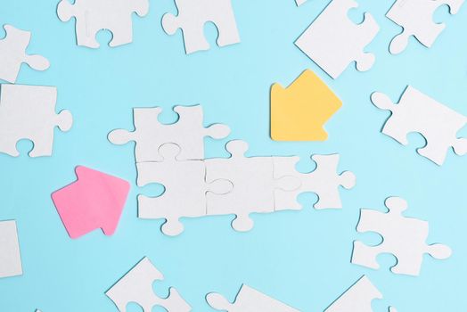 Building An Unfinished White Jigsaw Pattern Puzzle With Missing Last Piece