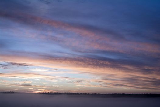 Fog and sky in clouds before sunrise.