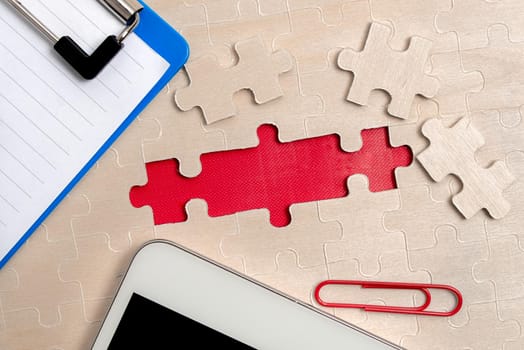 Building An Unfinished White Jigsaw Pattern Puzzle With Missing Last Piece