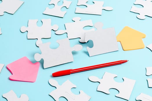 Building An Unfinished White Jigsaw Pattern Puzzle With Missing Last Piece