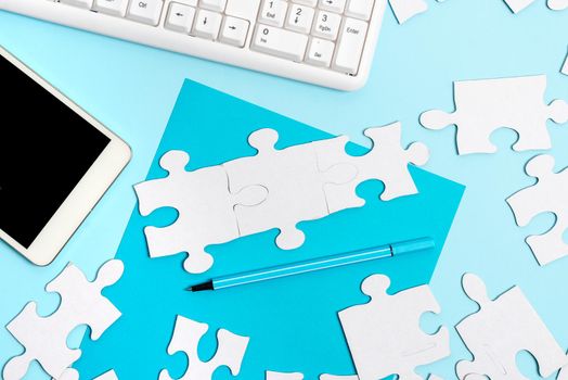 Building An Unfinished White Jigsaw Pattern Puzzle With Missing Last Piece
