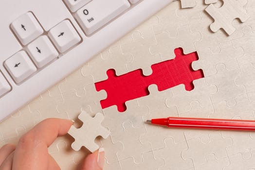 Building An Unfinished White Jigsaw Pattern Puzzle With Missing Last Piece
