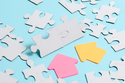 Building An Unfinished White Jigsaw Pattern Puzzle With Missing Last Piece