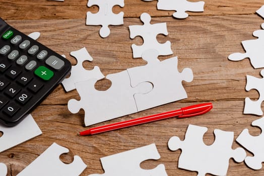 Building An Unfinished White Jigsaw Pattern Puzzle With Missing Last Piece