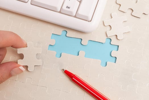 Building An Unfinished White Jigsaw Pattern Puzzle With Missing Last Piece