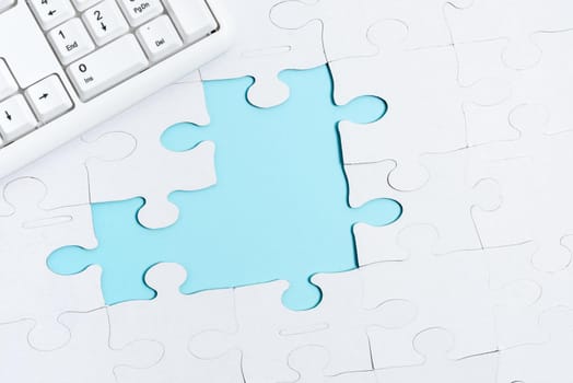 Building An Unfinished White Jigsaw Pattern Puzzle With Missing Last Piece