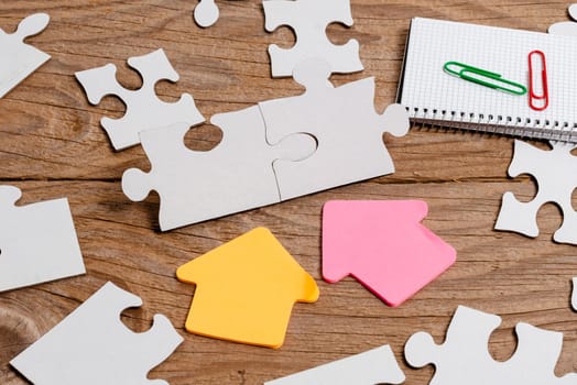 Building An Unfinished White Jigsaw Pattern Puzzle With Missing Last Piece
