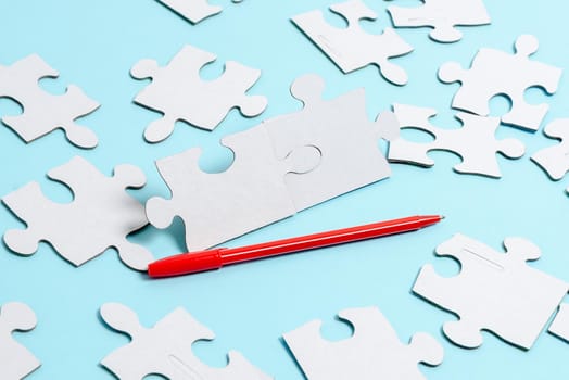 Building An Unfinished White Jigsaw Pattern Puzzle With Missing Last Piece