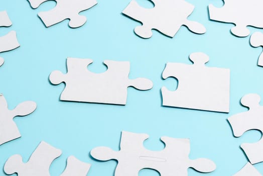 Building An Unfinished White Jigsaw Pattern Puzzle With Missing Last Piece