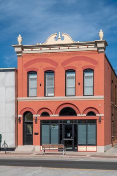 Brick building, with beautiful ornaments on the roof of a café in Ontario