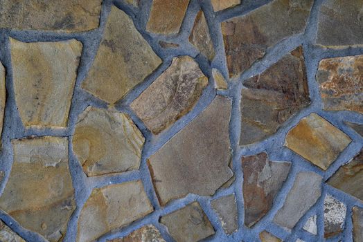 Fragment of a wall lined with sandstone stone