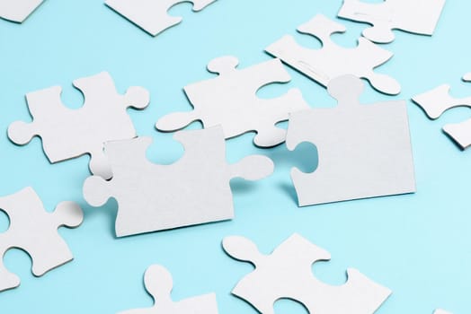 Building An Unfinished White Jigsaw Pattern Puzzle With Missing Last Piece