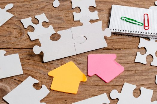 Building An Unfinished White Jigsaw Pattern Puzzle With Missing Last Piece