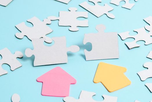 Building An Unfinished White Jigsaw Pattern Puzzle With Missing Last Piece