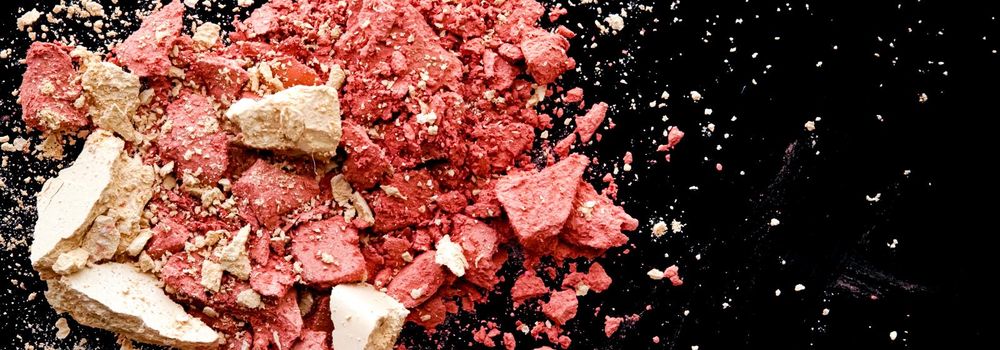 Crushed cosmetics, mineral organic eyeshadow, blush and cosmetic powder isolated on black background, makeup and beauty banner, flatlay design.