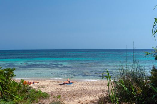 Formentera, Spain: June 12, 2021: People on Migjorn beach in Formentera in Spain in Times of COvid 19