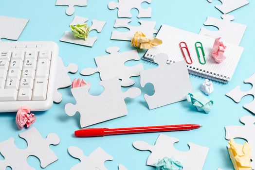Building An Unfinished White Jigsaw Pattern Puzzle With Missing Last Piece