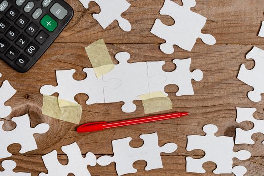Building An Unfinished White Jigsaw Pattern Puzzle With Missing Last Piece