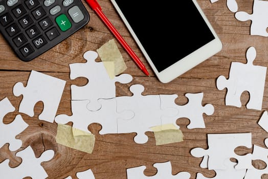 Building An Unfinished White Jigsaw Pattern Puzzle With Missing Last Piece