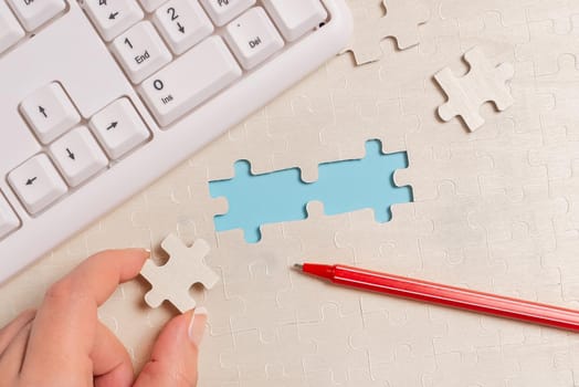 Building An Unfinished White Jigsaw Pattern Puzzle With Missing Last Piece
