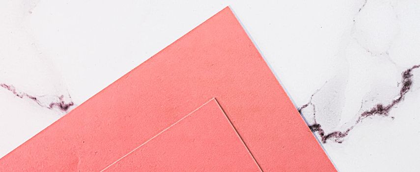 Pink A4 papers on white marble background as office stationery flatlay, luxury branding flat lay and brand identity design for mockups