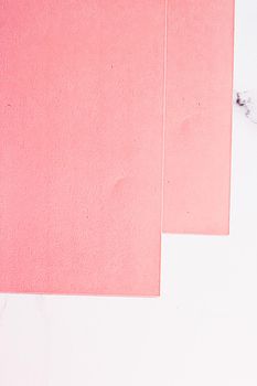 Pink A4 papers on white marble background as office stationery flatlay, luxury branding flat lay and brand identity design for mockups