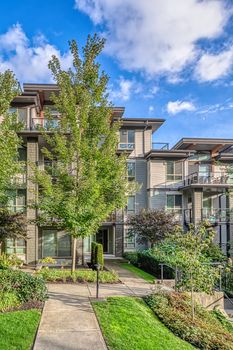 Residential apartment building on blue sky background.