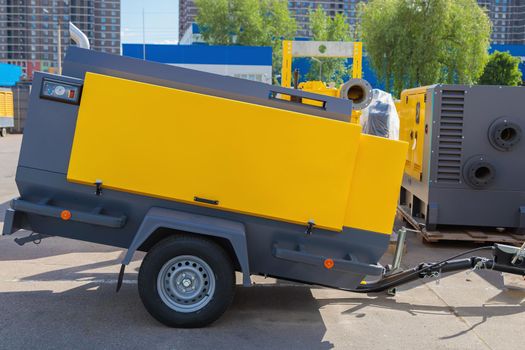 Mobile diesel compressor on wheels for supplying pneumatic air to devices.