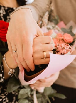 hands of newlyweds with rings closeup. wedding concept