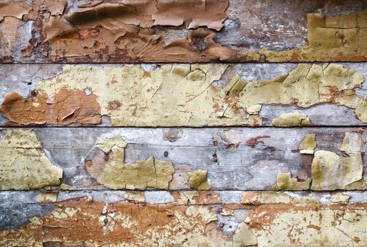 old plank wall with cracked paint. outdoor closeup. abstract background