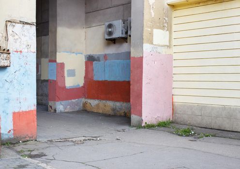 colorful walls in a poor neighborhood in the city on summer day