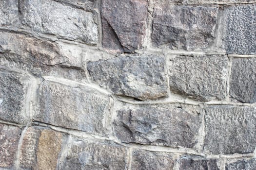 old wall of large stones outdoor closeup. abstract background