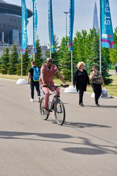 Saint Petersburg, Russia - June 12, 2021: People walk near Zenit Stadium during the Euro 2020 championship in St. Petersburg