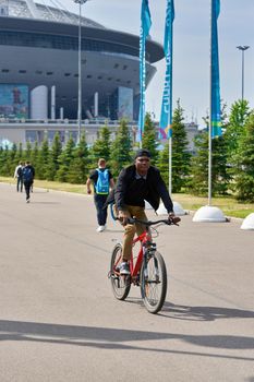 Saint Petersburg, Russia - June 12, 2021: People walk near Zenit Stadium during the Euro 2020 championship in St. Petersburg