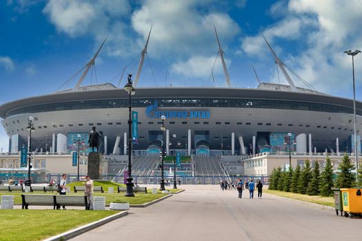 Saint Petersburg, Russia - June 12, 2021: People walk near Zenit Stadium during the Euro 2020 championship in St. Petersburg