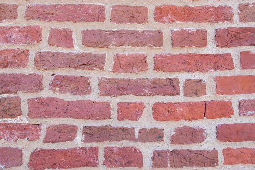 Close-up of an old red brick wall. Background, texture. Selective focus.