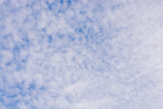 White color clouds cover the blue sky in the daytime