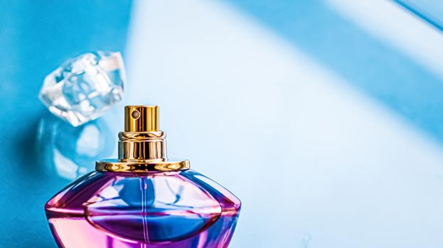 Perfume bottle on glossy background, sweet floral scent, glamour fragrance and eau de parfum as holiday gift and luxury beauty cosmetics brand design.