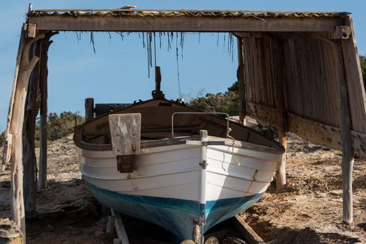 Fisherman's boat on the beach of Illetes in Formentera, Spain.